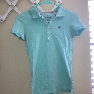 A celeste blue collared shirt 🐬